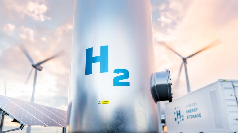 Hydrogen Tank with wind turbines in the background